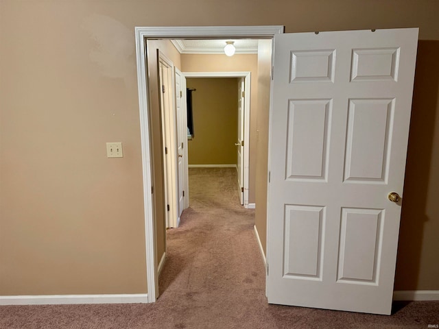 hall with light carpet and crown molding