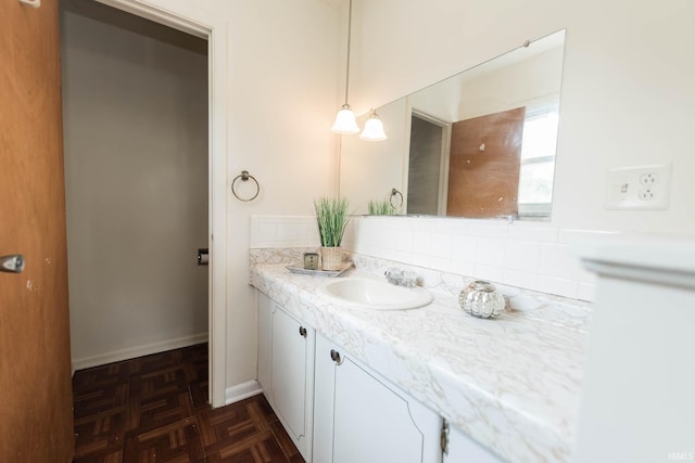 bathroom featuring vanity and parquet flooring