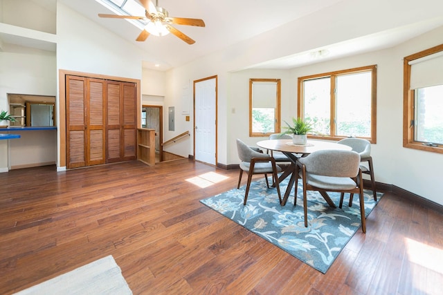 dining room featuring ceiling fan, dark hardwood / wood-style flooring, and high vaulted ceiling