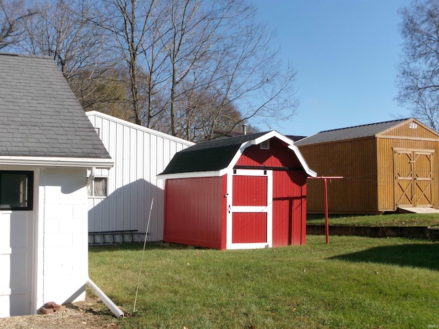 view of outbuilding with a yard