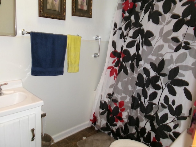 bathroom with tile patterned floors, vanity, and a shower with shower curtain