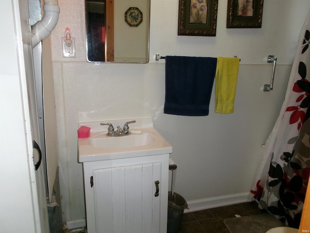 bathroom with tile patterned floors and vanity