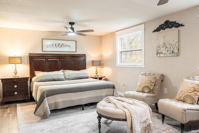 bedroom featuring ceiling fan and light wood-type flooring