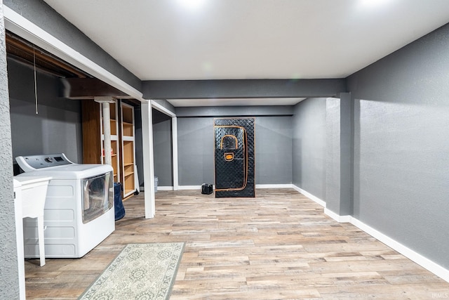 laundry room featuring wood-type flooring