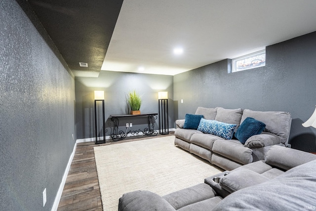 living room featuring dark wood-type flooring