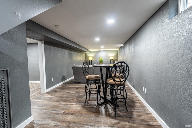 dining space featuring dark wood-type flooring