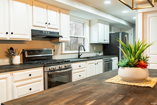 kitchen with white cabinets, stainless steel range with gas cooktop, and sink