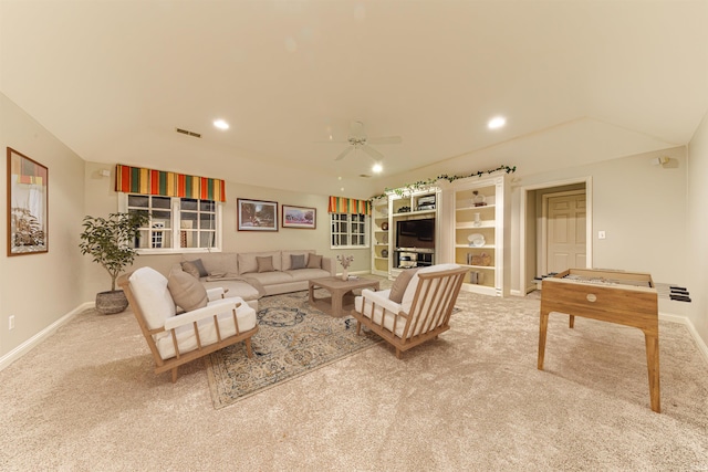 living room featuring ceiling fan and light carpet