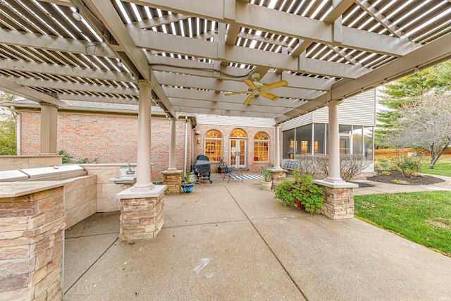 view of patio with a sunroom, ceiling fan, and a pergola