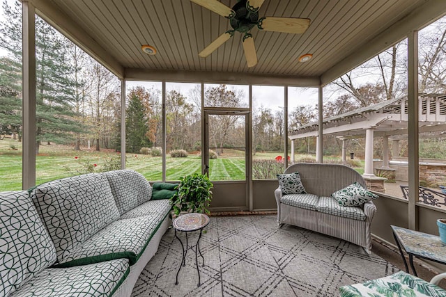 sunroom / solarium with ceiling fan and wooden ceiling