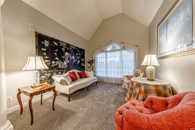 sitting room featuring carpet flooring and lofted ceiling