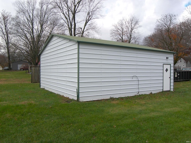 view of outdoor structure with a lawn