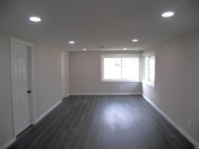 empty room featuring dark wood-type flooring