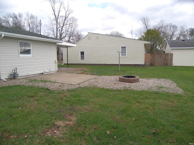 view of yard with a patio and an outdoor fire pit