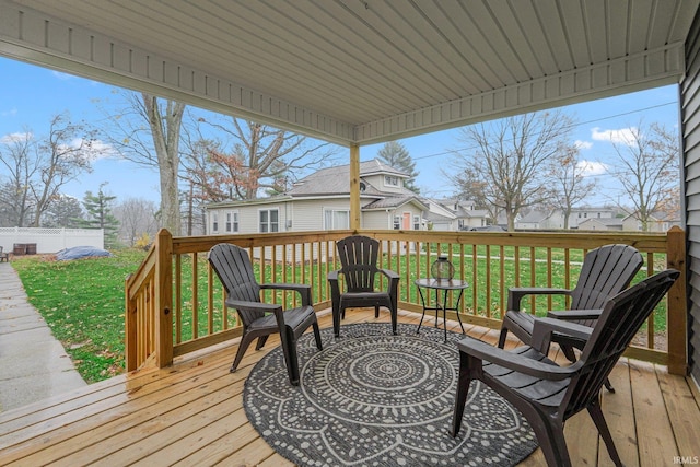 wooden deck featuring a yard