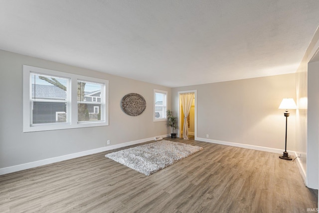 unfurnished room featuring light hardwood / wood-style floors