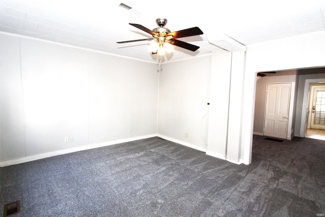 unfurnished room featuring ceiling fan and dark carpet