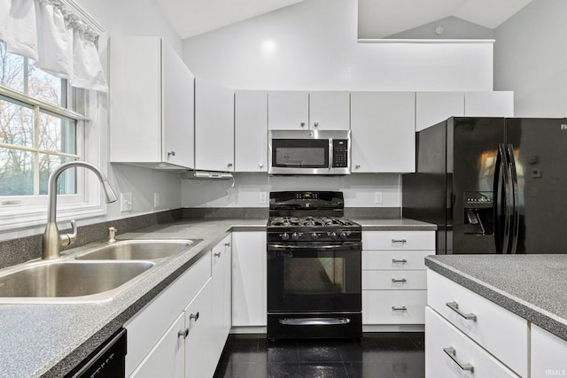 kitchen with white cabinets, sink, vaulted ceiling, and black appliances