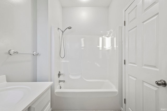 bathroom featuring vanity and shower / washtub combination