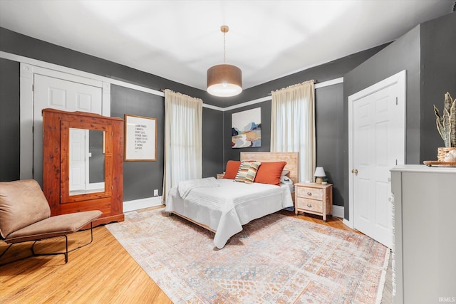 bedroom with hardwood / wood-style floors