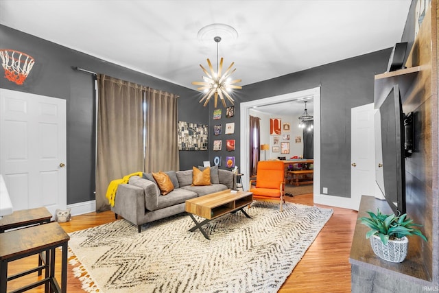 living room featuring hardwood / wood-style floors and a notable chandelier