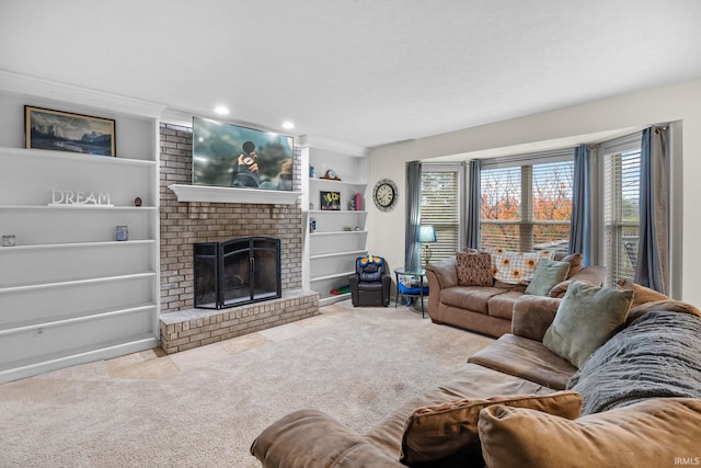 living room featuring crown molding, light colored carpet, and a fireplace