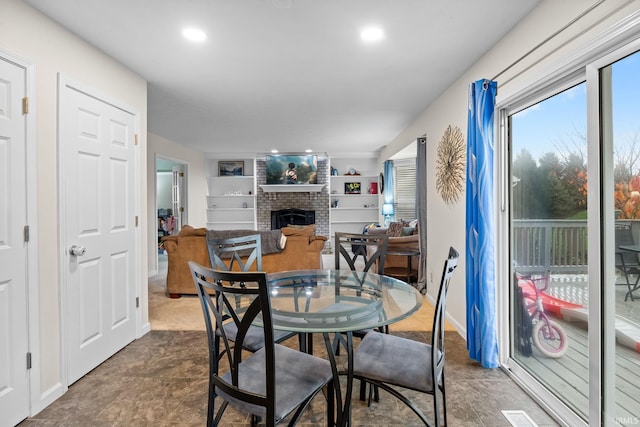 4819 Osprey Dr E, Lafayette, IN 47909 - dining space featuring a fireplace and recessed lighting