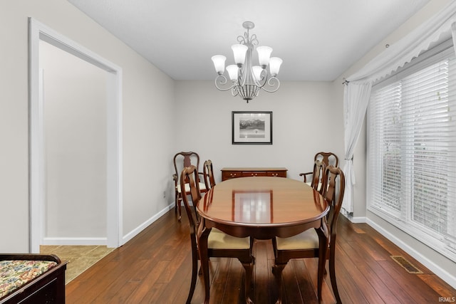 4819 Osprey Dr E, Lafayette, IN 47909 - dining space with dark wood-style flooring and a chandelier