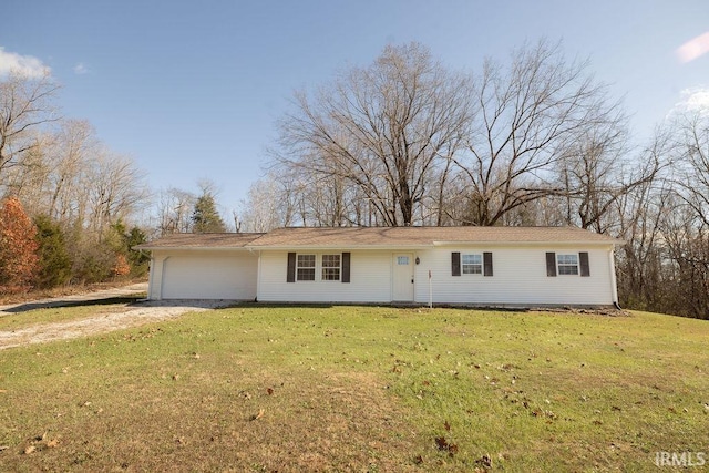 ranch-style house with a front yard and a garage