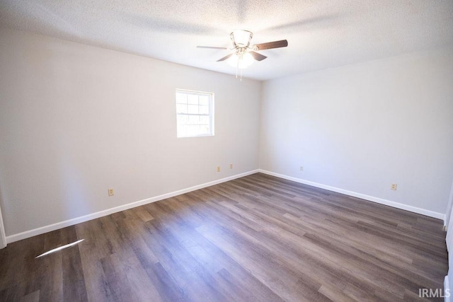 unfurnished room featuring a textured ceiling, dark hardwood / wood-style flooring, and ceiling fan