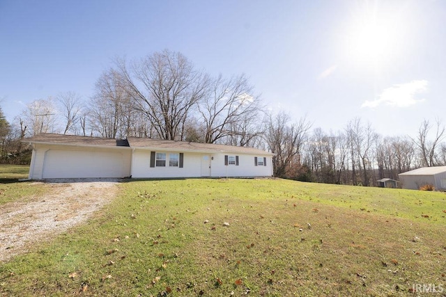 view of front of house featuring a front yard and a garage