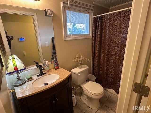 bathroom with tile patterned floors, vanity, and toilet