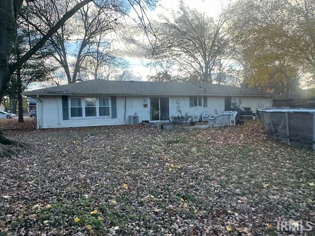 view of front of property with a patio and cooling unit