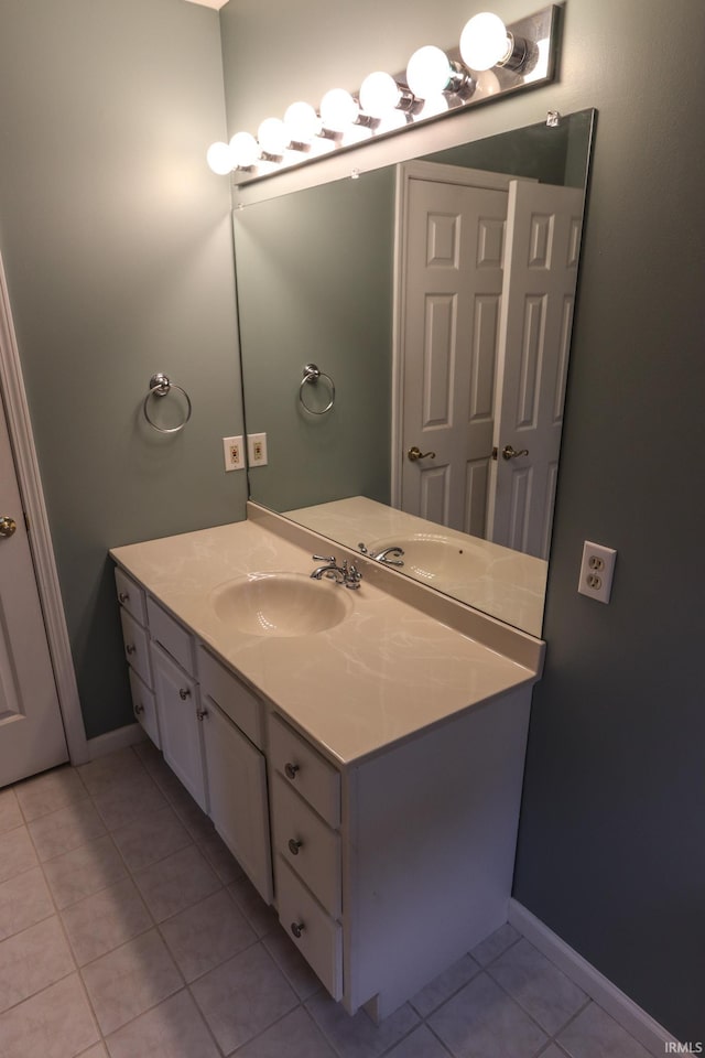 bathroom with tile patterned flooring and vanity