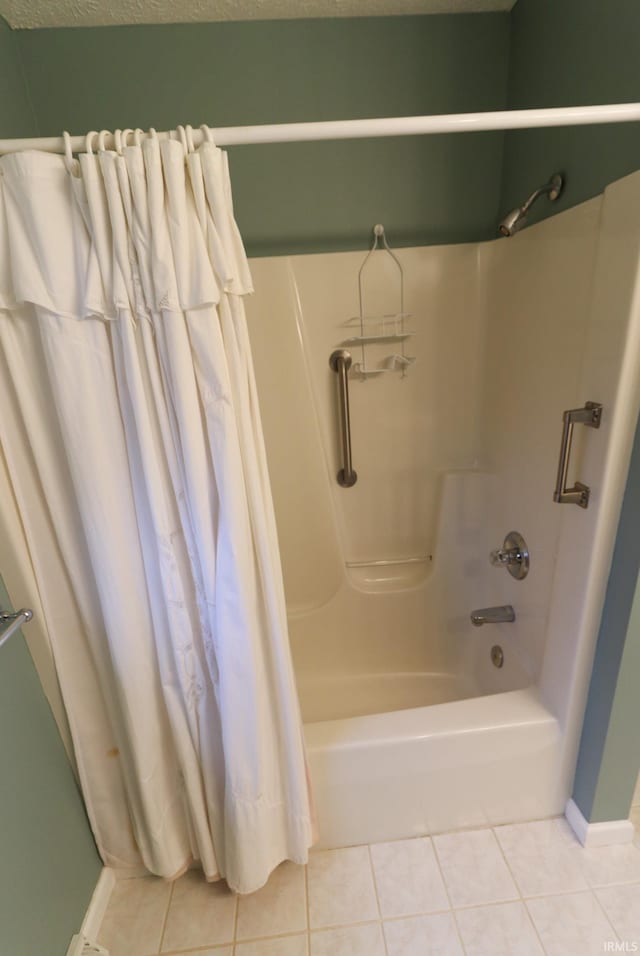 bathroom featuring tile patterned floors and shower / bath combination with curtain