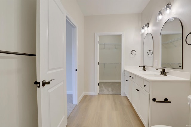 bathroom featuring vanity and wood-type flooring