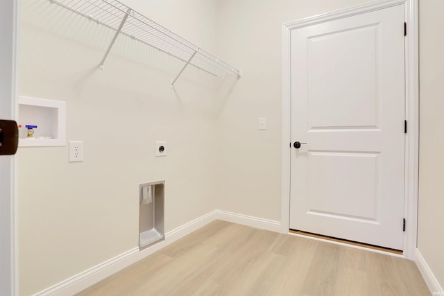 laundry room featuring hookup for a washing machine, hookup for an electric dryer, and light hardwood / wood-style floors