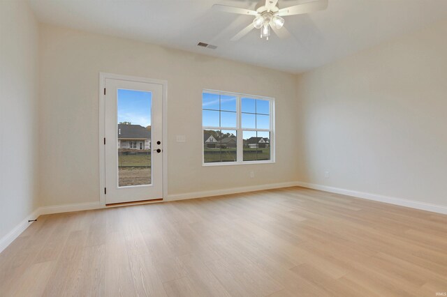 unfurnished room featuring ceiling fan and light wood-type flooring