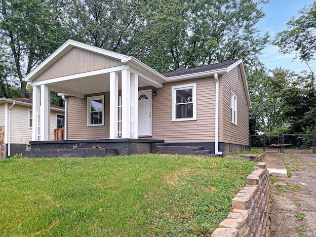 view of front of property with a front lawn and a porch