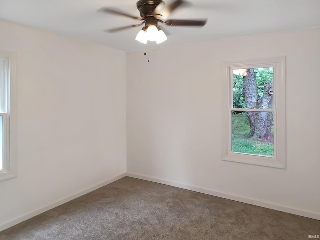 spare room with ceiling fan and carpet floors