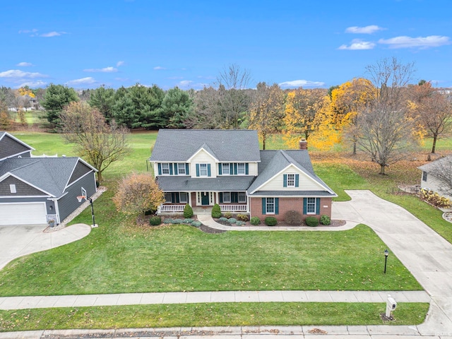 view of front of house with a porch and a front yard