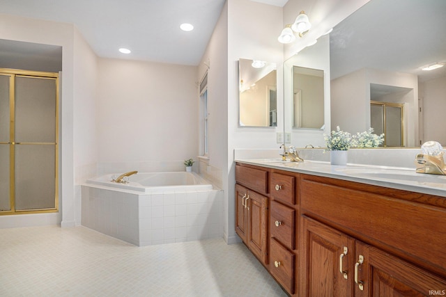 bathroom featuring tile patterned flooring, vanity, and independent shower and bath