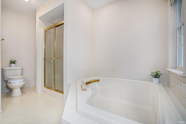 bathroom with tile patterned floors, toilet, and shower with separate bathtub