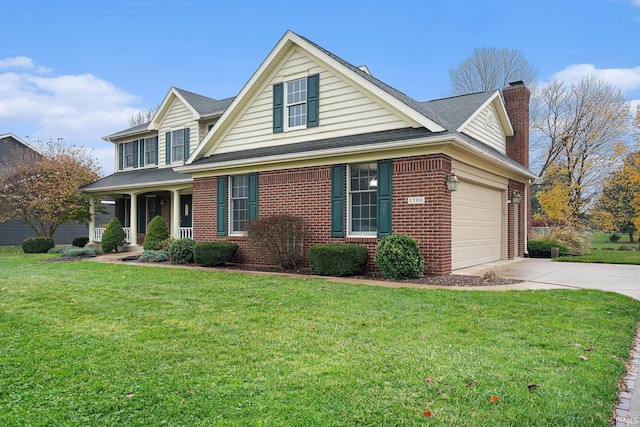 view of front facade with covered porch, a garage, and a front yard