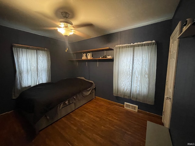 bedroom featuring ceiling fan and wood-type flooring