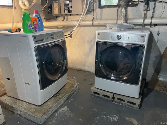 clothes washing area featuring washer and clothes dryer