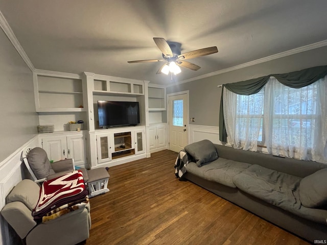 living room featuring dark hardwood / wood-style flooring, a wealth of natural light, crown molding, and ceiling fan