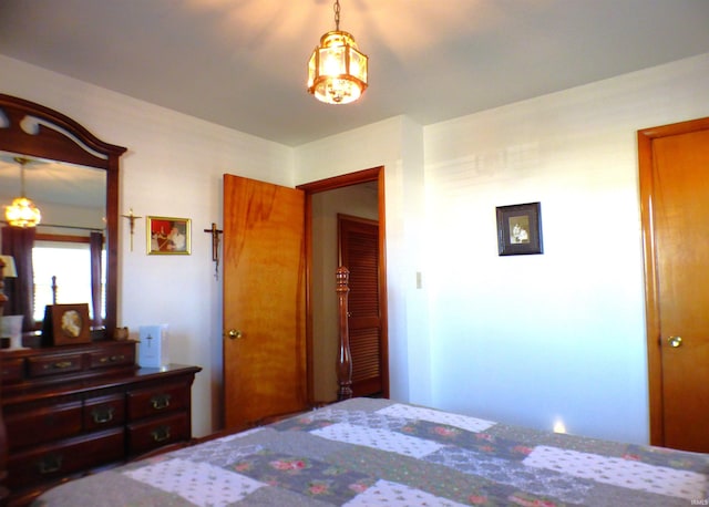 bedroom featuring an inviting chandelier