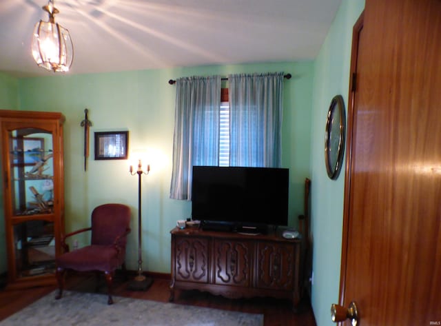 208 Sycamore St, Loogootee, IN 47553 - living room featuring baseboards and wood finished floors