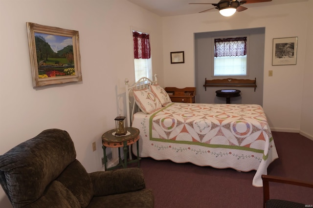 bedroom featuring multiple windows and ceiling fan